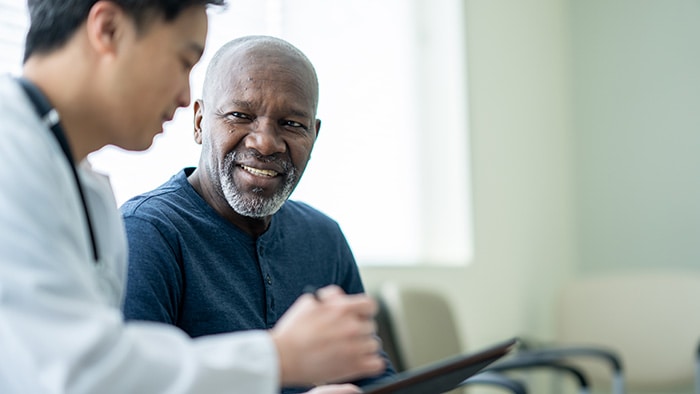 A healthcare professional and their patient in discussion